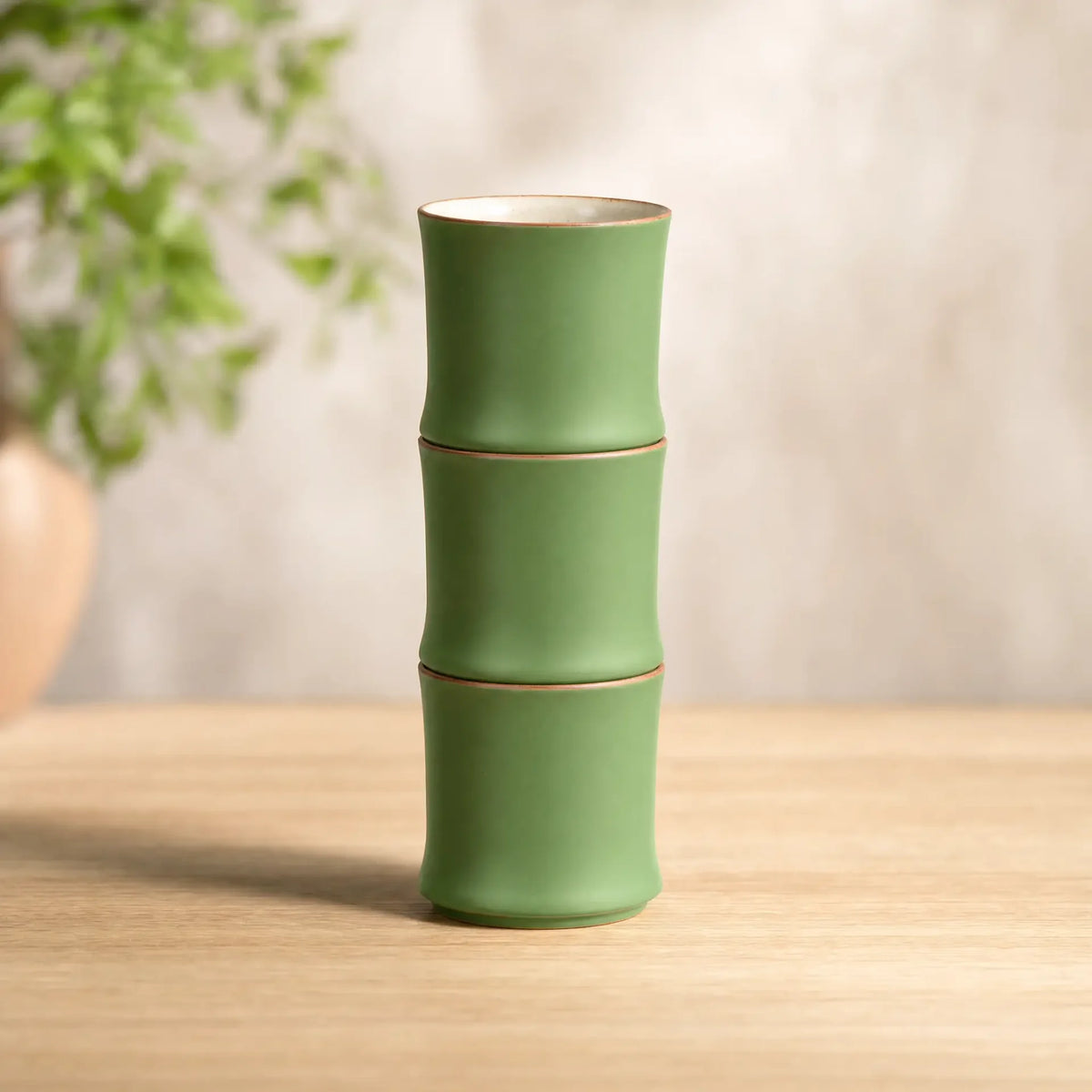 Three bamboo ceramic cups stacked into one tall bamboo tower
