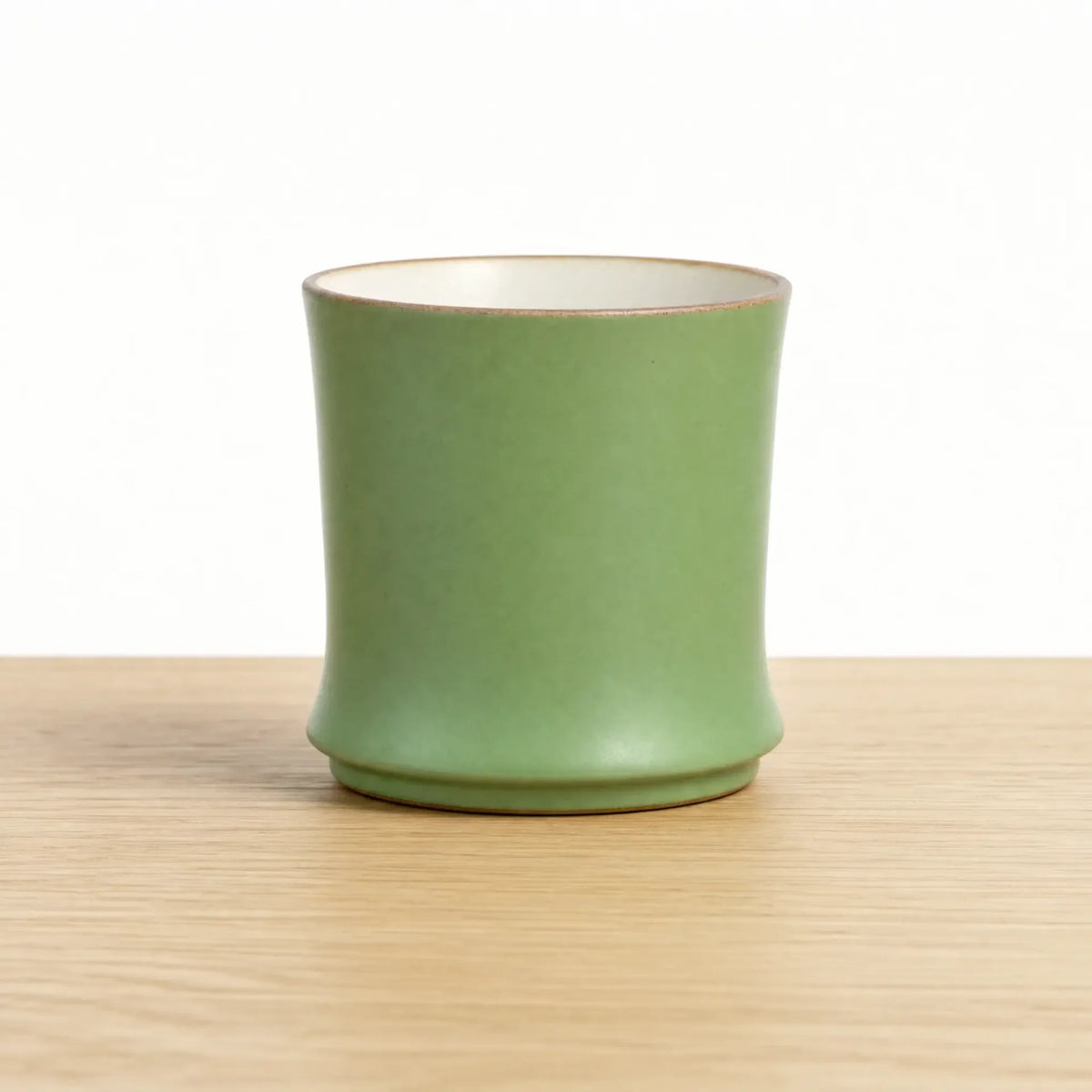 Single stackable bamboo ceramic cup in matte green